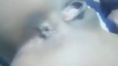 Teen Desi beauty holds the camera and shows off her shaved XXX twat