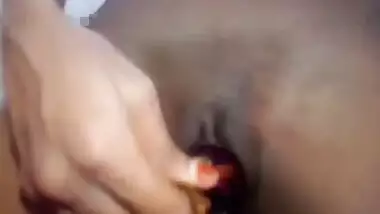 Indian girl plays XXX games on camera shoving an eggplant in her sex hole