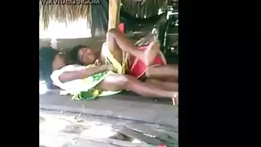 Young couple enjoy outdoor sex in a tent house on the beach